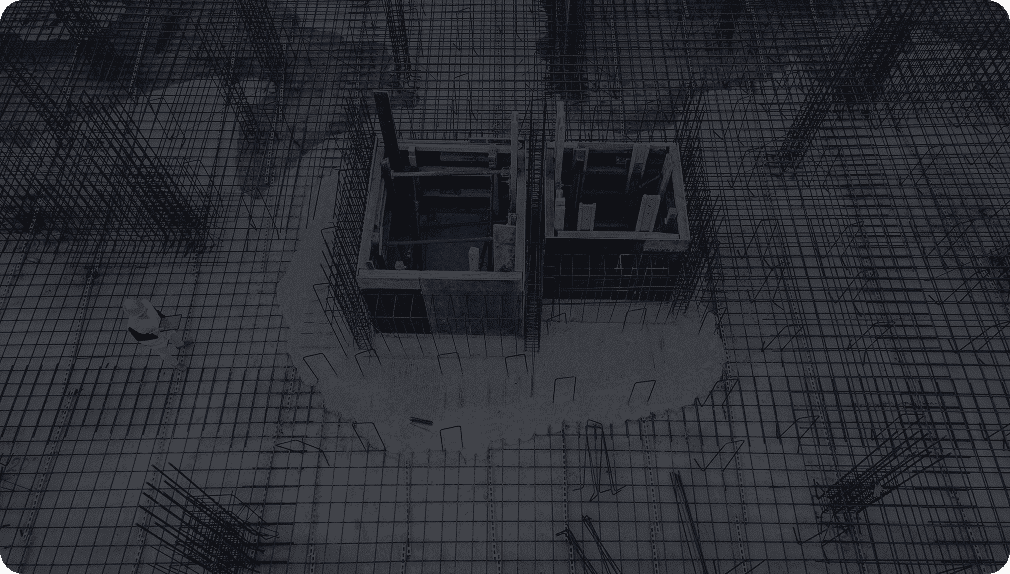 Construction site with steel rebar and worker.